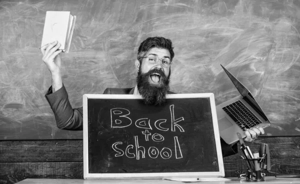 Study with us. Private school advertising boost enrollments. Teacher or school principal welcomes blackboard inscription back to school. Teacher welcomes pupils study traditional and modern subjects — Stock Photo, Image