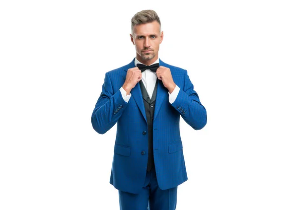 Grizzled man in blue suit and bow tie. businessman isolated on white. boss in formal wear —  Fotos de Stock