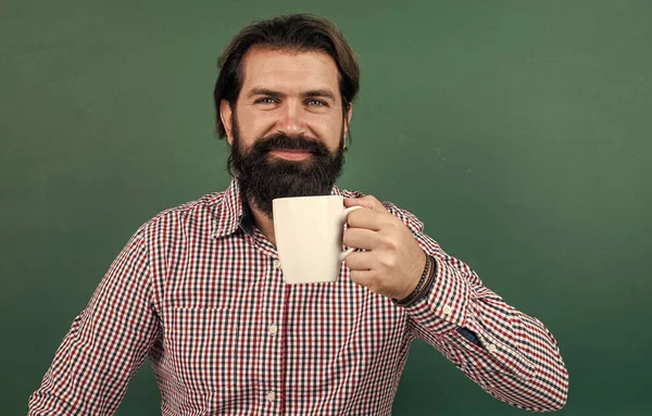 Happy man drinking morning coffee from cup on green background, energy — Fotografia de Stock