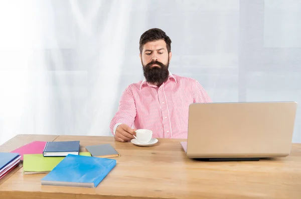 Serious businessman at office desk. Office work. Tea break — 스톡 사진