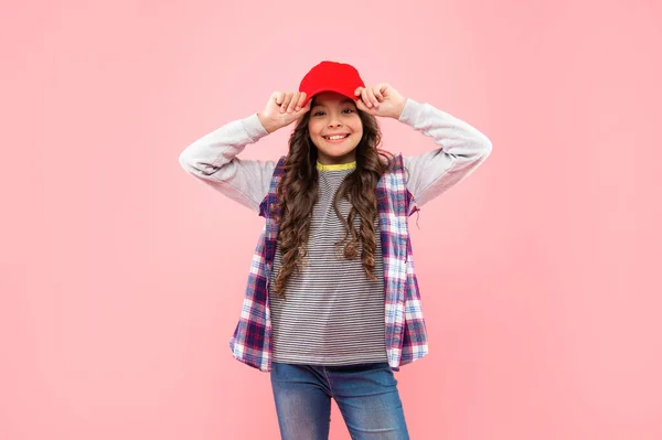 Portrait of frizz child. haircare and skincare. hairdresser. happy kid with curly hair in cap. — 图库照片