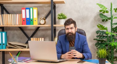 positive man freelancer use online computer communication at office holding coffee, modern life.