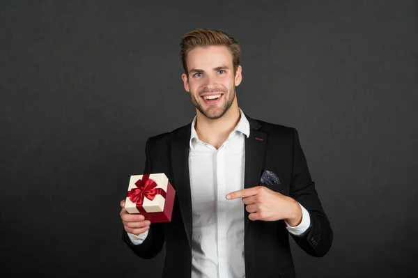 Happy businessman point finger on business reward for occasion greeting — Zdjęcie stockowe