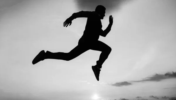 Freedom is not enough. personal achievement goal. man silhouette jump on sky background. confident businessman running. daily motivation. enjoying life and nature. business success. freedom — Stock Photo, Image