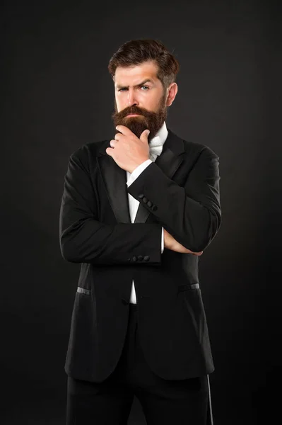 Brutal gentleman in tuxedo on black background, menswear — Stock Photo, Image