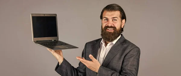 High quality notebook. go shopping online. confident businessman with laptop. brutal male with beard in suit. handsome ceo hold computer. boss and employee. agile business. online education concept — Stock Photo, Image