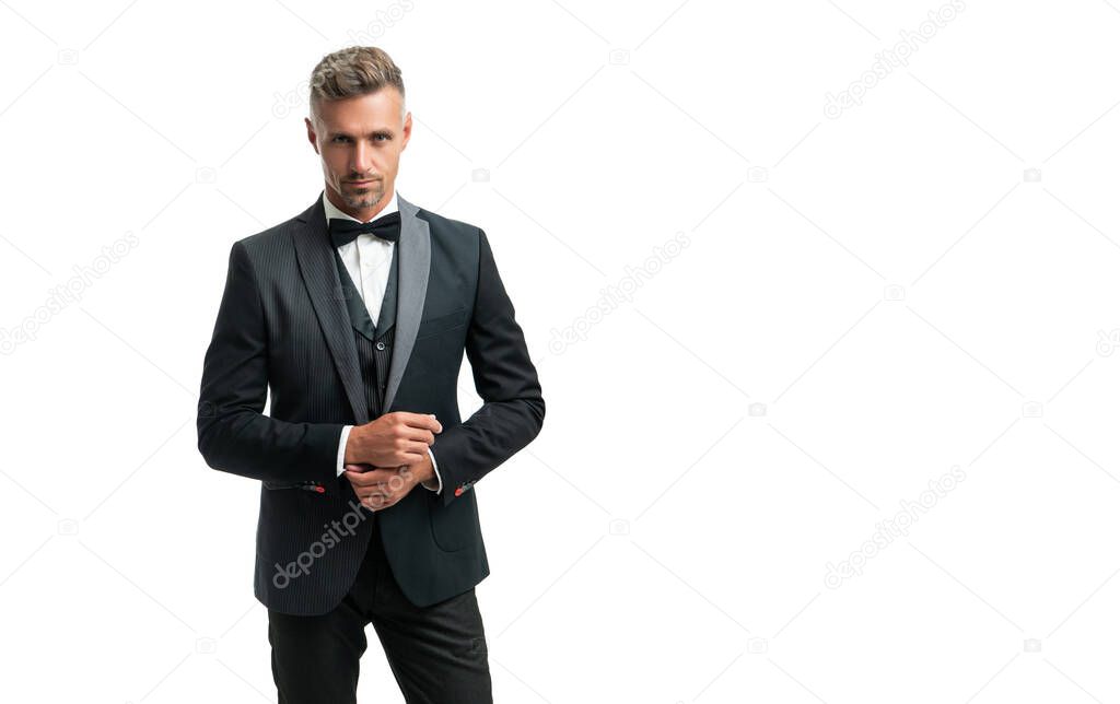 mature man in bow tie suit. businessman isolated on white. leader in tux formal wear.