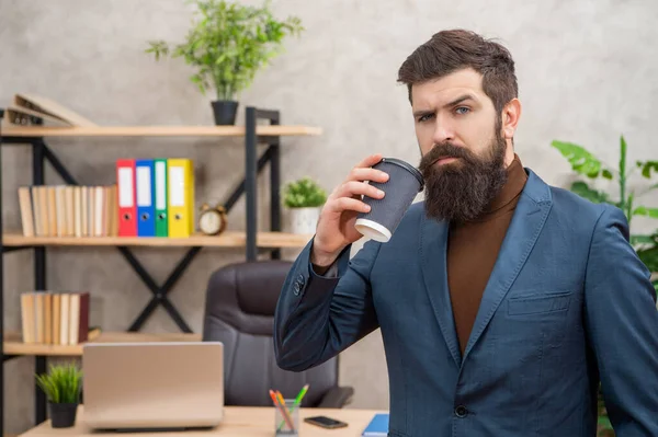 Mature entrepreneur in jacket having coffee break with cup at office, takeaway — Stock Photo, Image