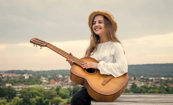 Teenager girl play guitar. childhood happiness. music and vocal. follow your own style. — Stock Photo, Image