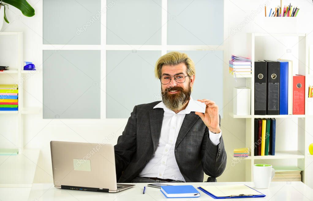 Giving business advice. confident brutal businessman. Elegant businessman analyzing data in smartphone. Quarantine agile business. lawyer at work. his business card. bearded man sit at desk in office