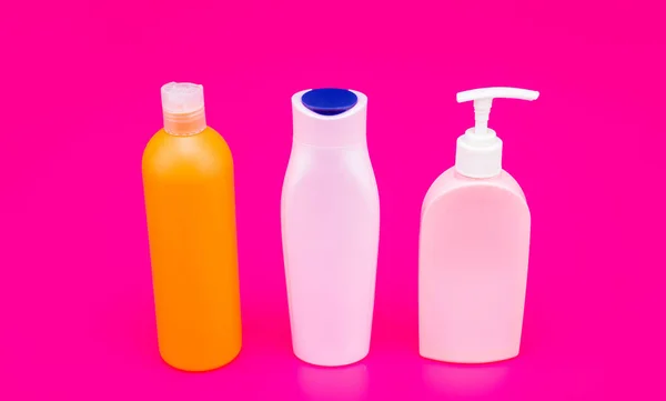 For gel and shampoo storing. Cosmetic bottles. Bottles with flip cap and pump dispenser — Stock Photo, Image