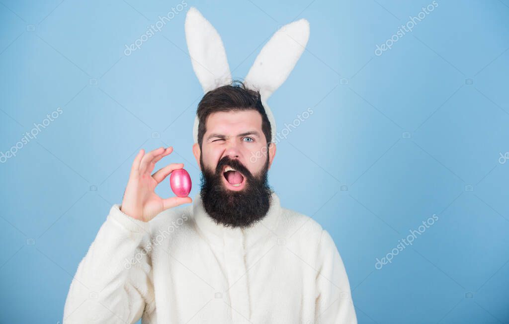 Easter bunny. Funny bunny with beard and mustache. Join celebration. Having fun. Grinning bearded man wear silly bunny ears. Easter symbol concept. Hipster cute bunny long ears blue background