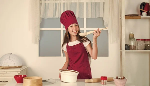 Girl kid in chef apron and hat cooking, bakery — Stock Photo, Image