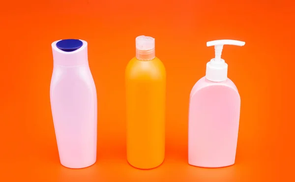 For cosmetic packing. Packaging bottles. Refillable bottles with flip cap and pump dispenser. HDPE — Stock Photo, Image