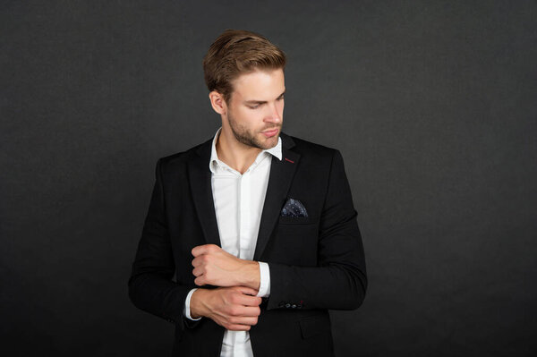 handsome businessman in shirt and jacket on black background, business