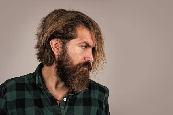 He got great style. barbershop concept. copy space. bearded man in checkered shirt. casual guy express human emotions. hipster with long hair and moustache. male beauty and fashion — Stock Photo, Image