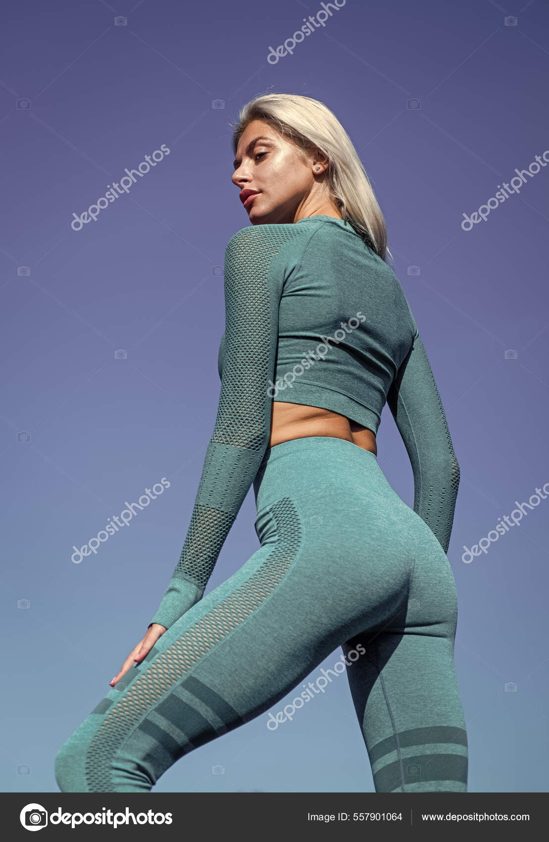 Lady has tight ass. sportive woman in sportswear. sexy woman on stadium gym  Stock Photo by ©stetsik 557901064