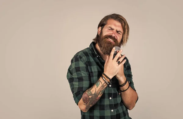 Modern looking bearded hipster with mic. music concept. brutal handsome man with moustache singing. mature guy sing song in microphone. karaoke. casual fashion styled singer — Stock Photo, Image