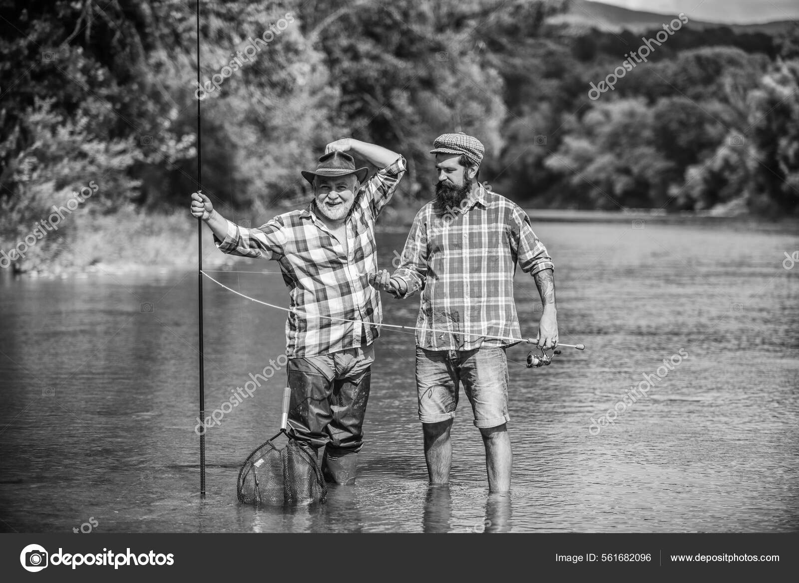 Bound Together In Love. two happy fisherman with fishing rods. summer  weekend. mature men fisher. father and son fishing. hobby and sport  activity. Trout bait. male friendship. family bonding — Stock Photo ©