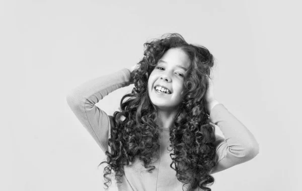 Freedom self expression. Girl hairdresser salon. Brushing long hair. Little child curly hair. Fashion and beauty. Enjoying shiny curls. Hairstyle party. Hairdresser supplies. Professional cosmetics — Stock Photo, Image