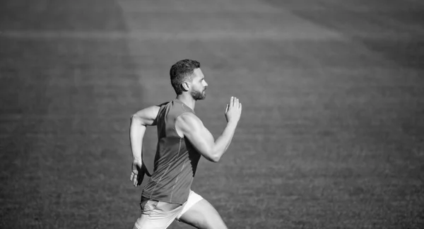 Energetic man on running track. sporty runner. stamina. sport and endurance. outdoor stadium sprint. — Stock Photo, Image