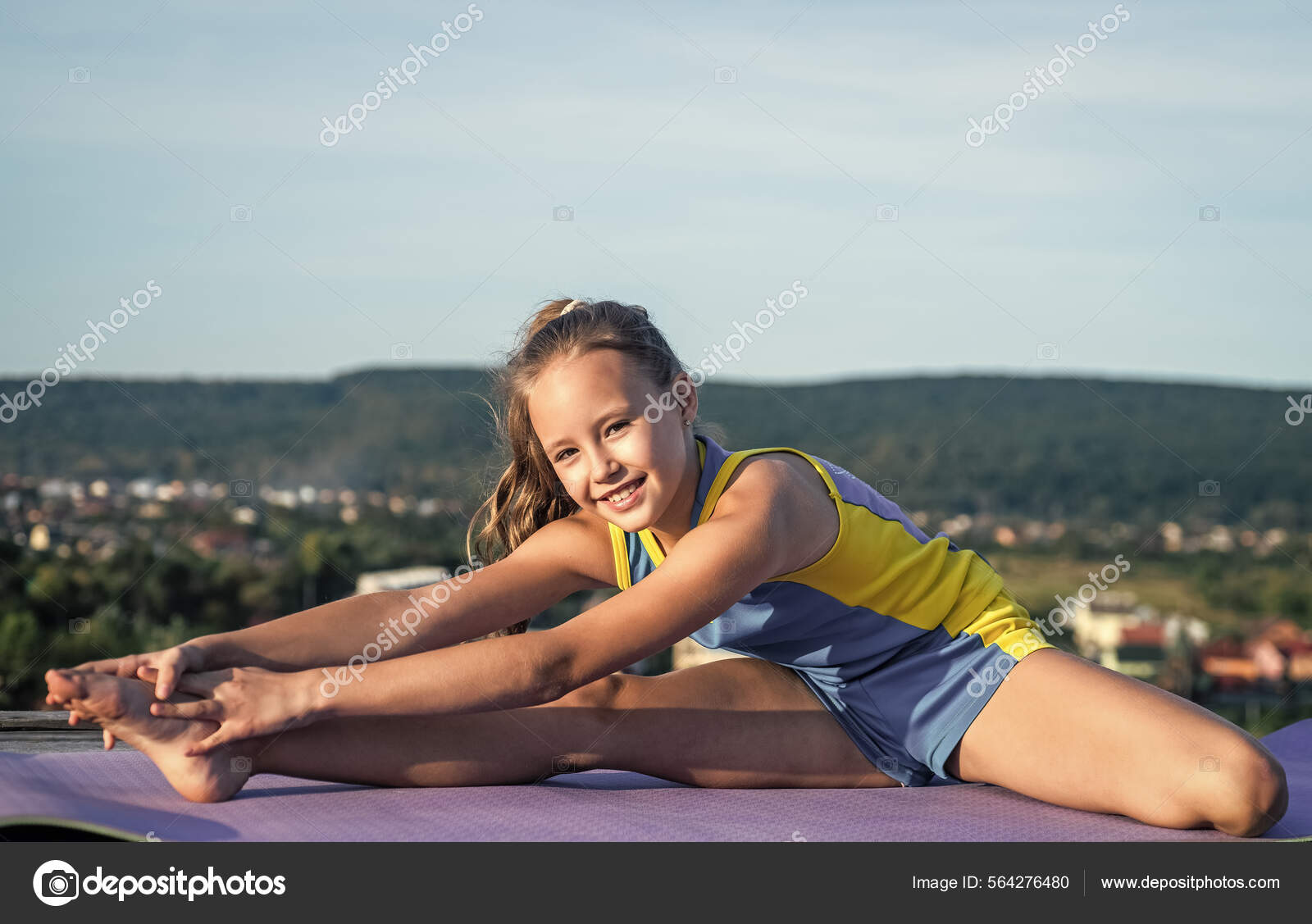 Teen girl warming up. sporty kid in sportswear outdoor. sport and fitness.  healthy lifestyle. Stock Photo by ©stetsik 564276480