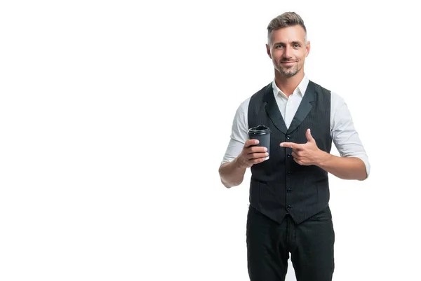 Happy guy in suit vest pointing finger at disposable cup with takeaway tea isolated on white — 스톡 사진