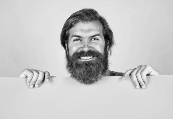 Fall savings are in the air. bearded man holding placate. wanted. empty paper for your information. barber concept. happy hipster with beard at paper sheet. empty place for copy space. need help — Stock Photo, Image