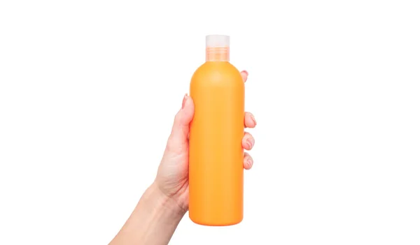 Female hands hold keratin bottle with copy space — Stock Photo, Image