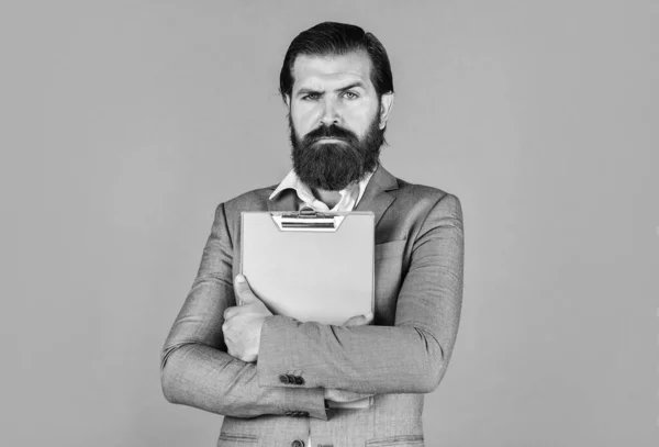 Ready for sale. Pleasant cheerful handsome realtor holding folder. bearded man working in office. Portrait of successful businessman dressed in formal clothes. serious boss with document — Stock Photo, Image