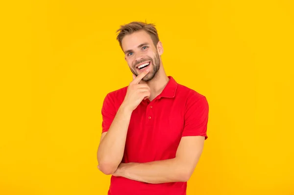 Cheerful young man with beard on yellow background. hair and beard care. — стоковое фото