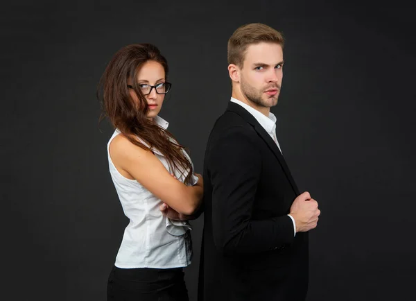 Successful businessman and brunette businesswoman on black background, partners — Foto Stock