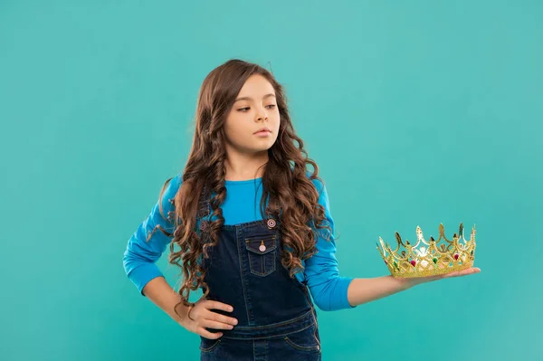 self confident queen. expressing smug. arrogant princess in tiara. proud kid with curly hair.