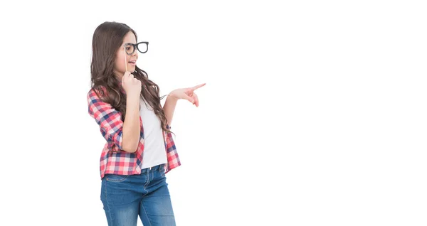 Arrogant teen kid with party accessory isolated on white background point finger on copy space — стоковое фото