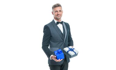 cheerful businessman in tuxedo with box isolated on white. boxing day