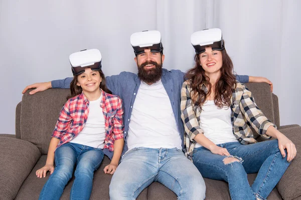 Father mother and child wireless VR glasses. virtual reality family. happy parents with kid girl — Stockfoto