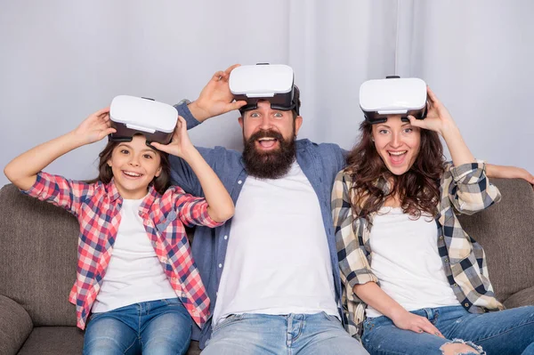 Happy parents with kid spend time together in vr glasses at home, family — Foto de Stock