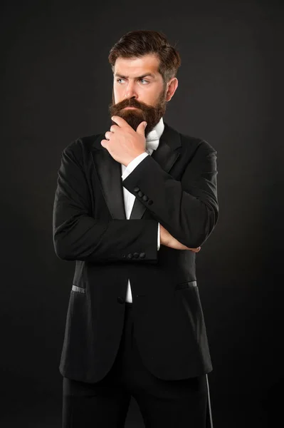 Bearded man in tuxedo on black background, menswear — Stockfoto