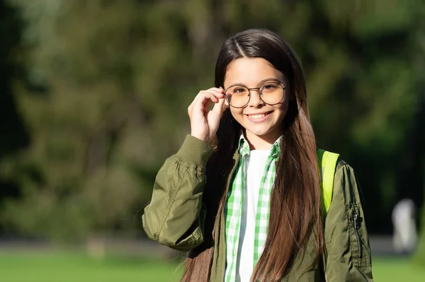 Cheerful kid with backpack wear glasses. back to school — Stok fotoğraf