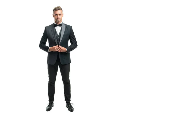 Full length of grizzled man bridegroom in formal tuxedo isolated on white with copy space — Stockfoto