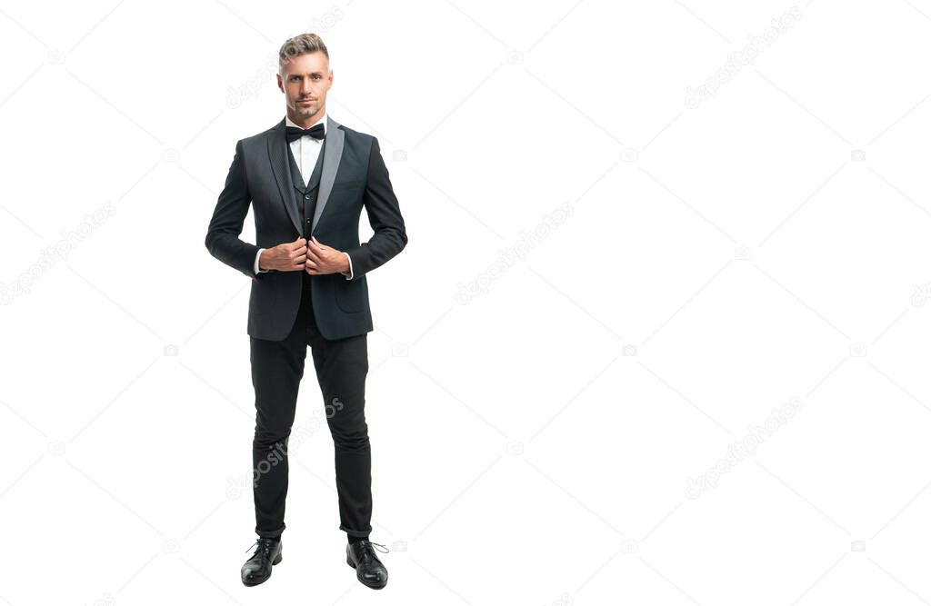 full length of grizzled man bridegroom in formal tuxedo isolated on white with copy space
