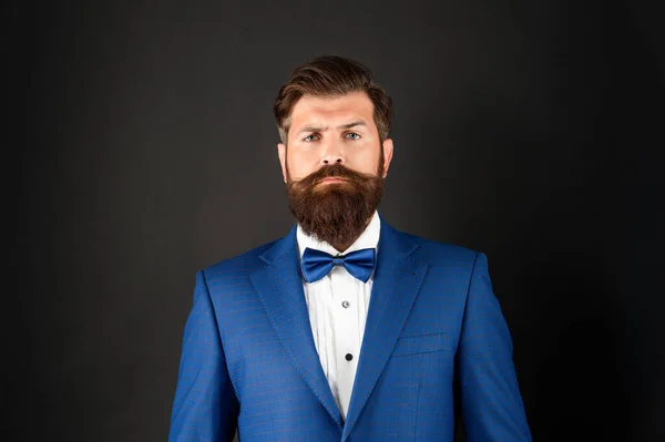 Portrait of serious man in tuxedo bow tie. bride groom in formalwear on black background. — Fotografia de Stock