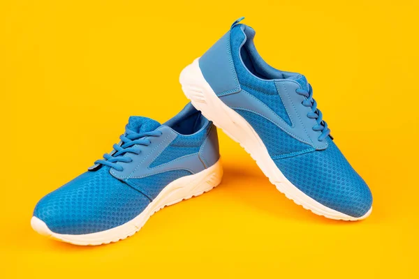 Athletic footgear for running. pair of comfortable sport shoes. sporty blue sneakers. — Stock Photo, Image