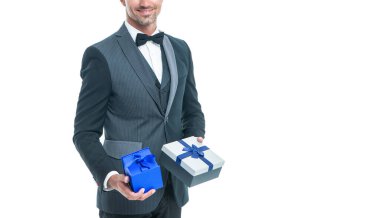 happy businessman in tuxedo with box isolated on white. boxing day