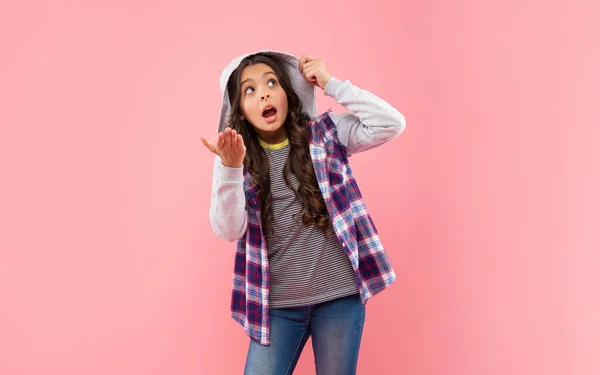 Shocked kid with curly hair in hood. teen hipster beauty hairstyle. female casual fashion model. — Zdjęcie stockowe
