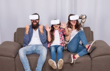 father mother and child wireless VR glasses. virtual reality family. happy parents with kid
