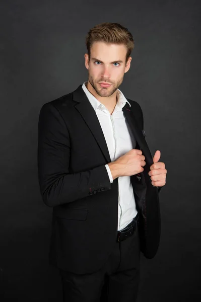 Professional man taking pocket check in formal suit jacket dark background, formalwear — ストック写真
