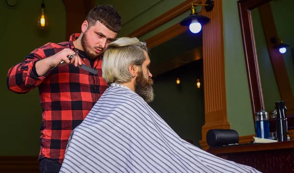 Portrait of stylish man beard. shaving. Hairstylist in barbershop. man in hair salon with hipster haircut. beard and mustaches. Professional hairstylist in barbershop interior. Macho has stylish hair — Photo