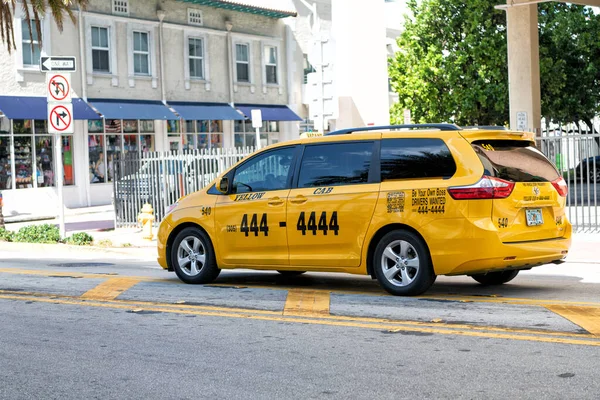 Miami Beach, Florida USA - April 14, 2021: toyota yellow cab taxi car on the road, side view — Stock Photo, Image