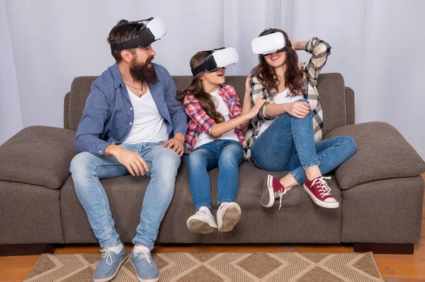 Positive mother father and daughter in virtual reality glasses, video game — Foto de Stock